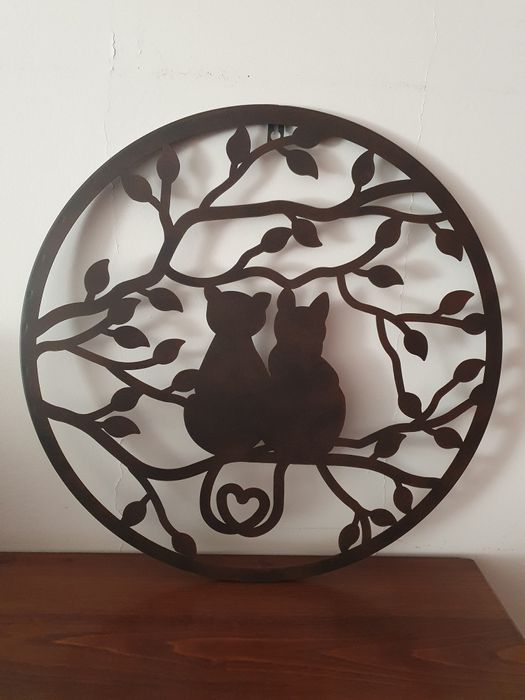 Peça decorativa em metal para pendurar