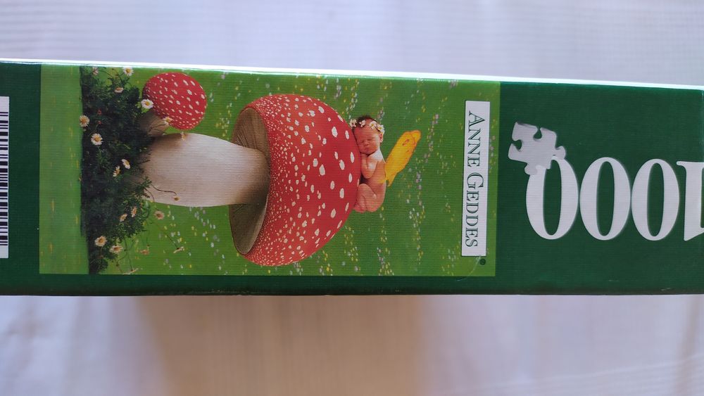 Puzzle 1000 peças Anne Geddes Borboleta dormindo sobre cogumelo. Novo