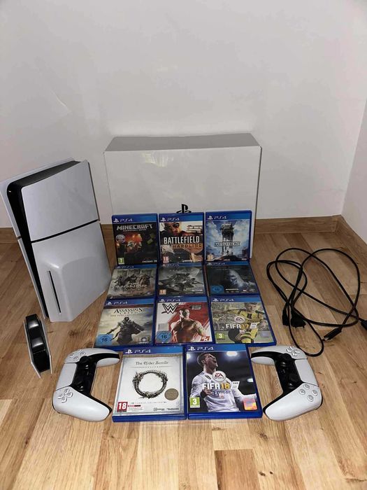 PlayStation 5 z dwoma padami, kilkoma grami i stacja dokującą