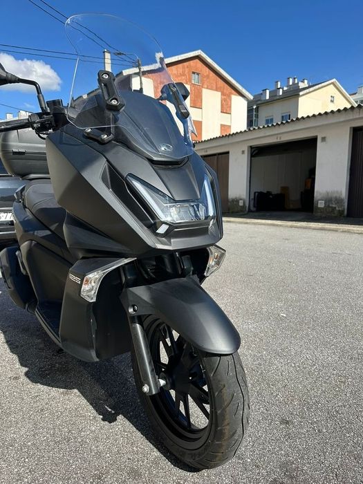 Mota 125  Kymco Sky Town