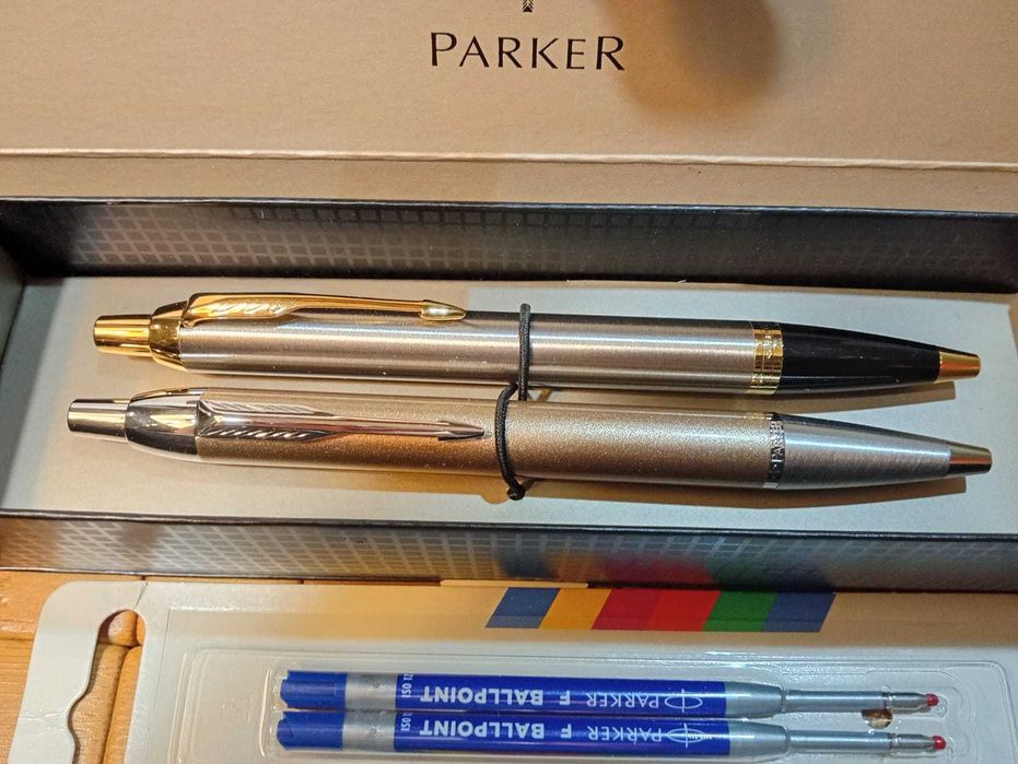 Dwa długopisy Parker IM, starszy i nowy wzór, nowe w pudełku Parker