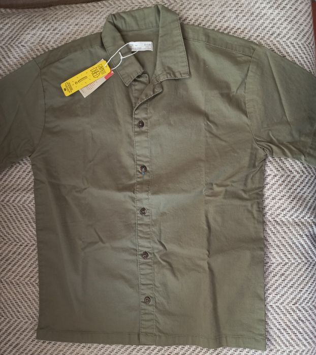 NOVA. Blusa caqui. Zippy