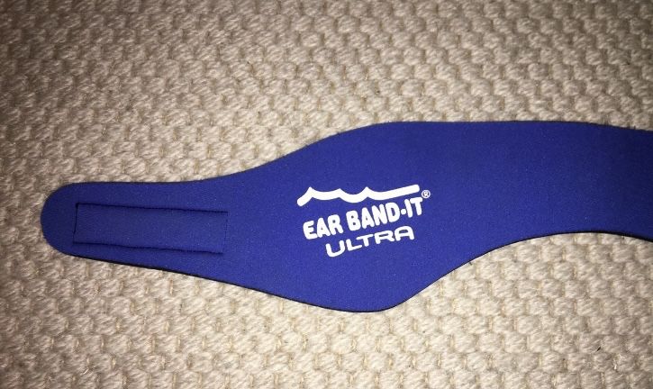 Banda tapa ouvidos da marca “Ear band it”