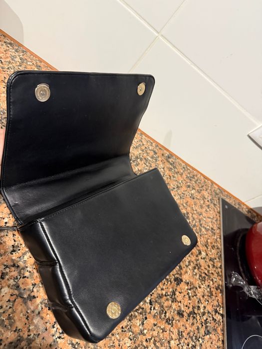 Luxury handbag with red interior