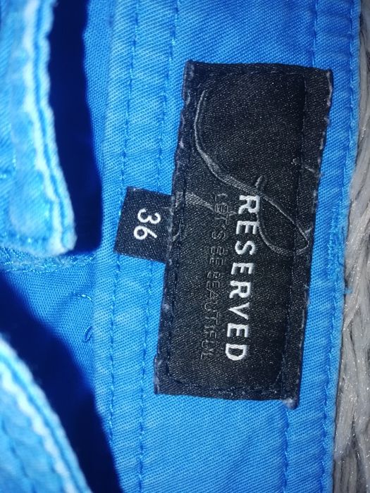 Reserved niebieskie spodnie z zamkami r. 36