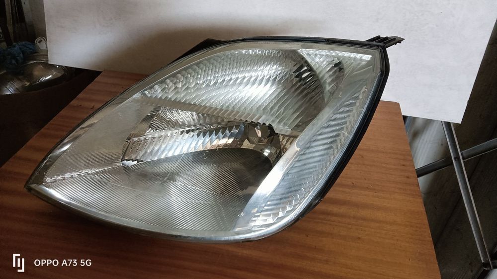 Farol Ford fiesta 5 ótica 2004 esquerda original