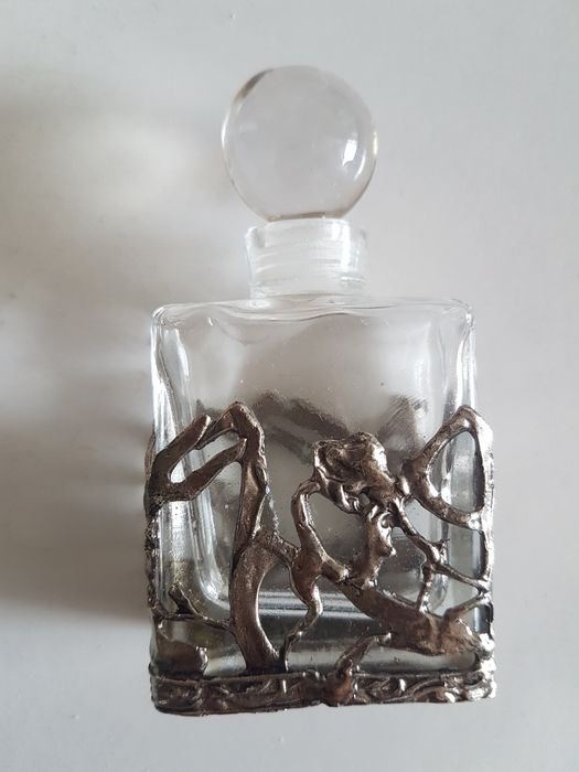 Bottle with metalwork