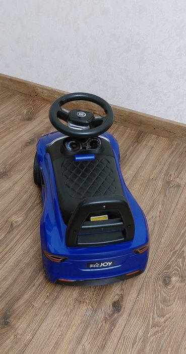 Машина-толокар для катання Tesla JOY з музичним кермом