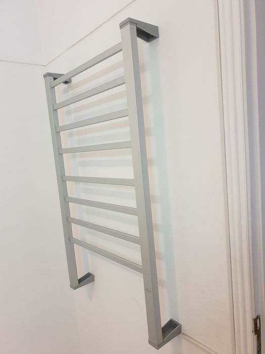 Aquecedor de parede para toalhas.