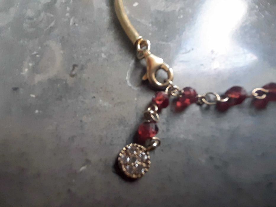 Pulseira prata dourada, Nunca usada
