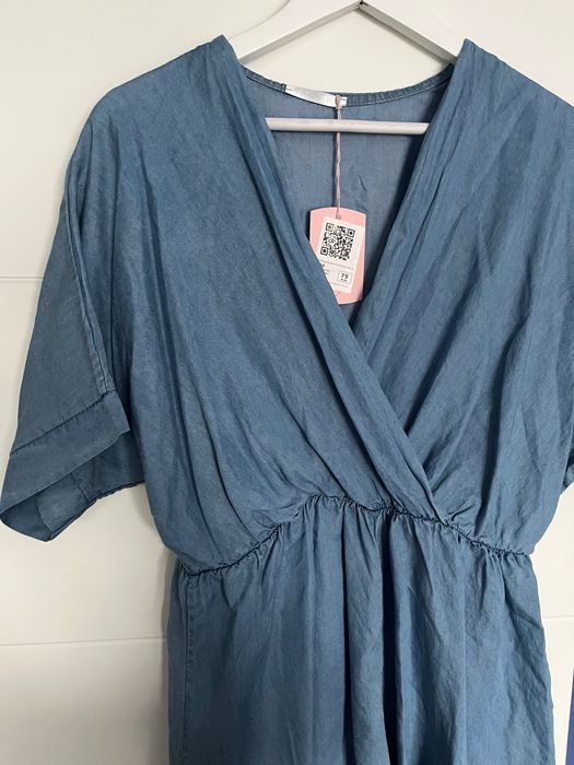 Kombinezon z rękawem, krótki - nowy  :)