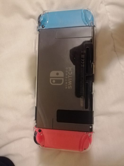 Nintendo Switch with Two Games, Charger, and Carrying Case64738628946051123