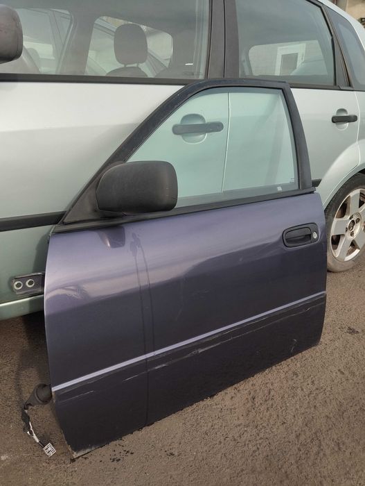 Toyota Corolla E11 1.4i 5D 1998r. Lusterko zewnętrzne lewe.