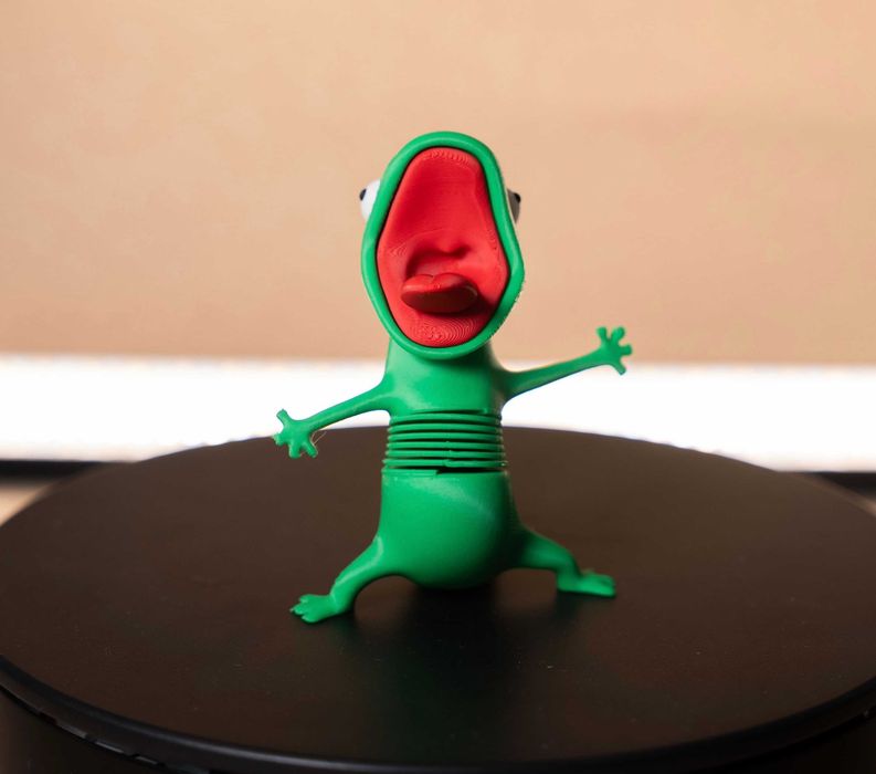 Рухома іграшка ящірка Том на пружині з мультфільму Хопперс. 3D-Іграшка Lizard Tom.