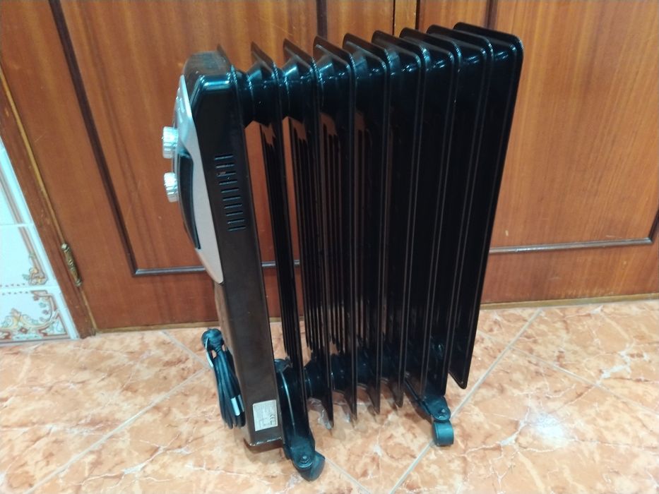 Aquecedor radiador a óleo casa quarto apartamento vivenda escritório gabinete cozinha.