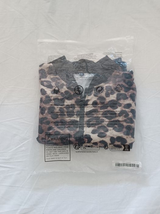 Casaco leopardo novo