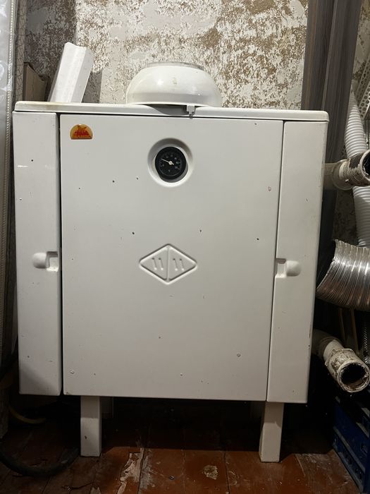 Котел газовий гелиос 10 лівостронній димохідний