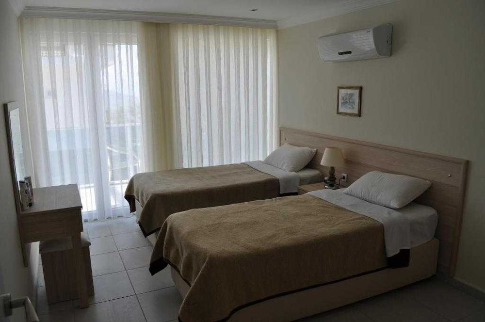 Аренда апартаментов 2+1, 90 м.кв. Личный сад с барбекю.Олюдениз,Турция