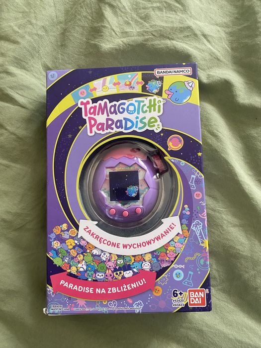 Fioletowe tamagotchi paradise wirtualne zwierzatko bandai 6+