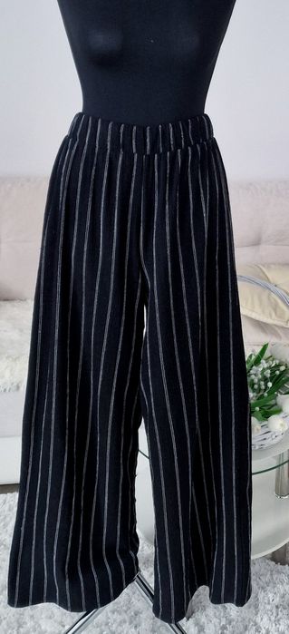 Spodnie szerokie nogawki H&M".