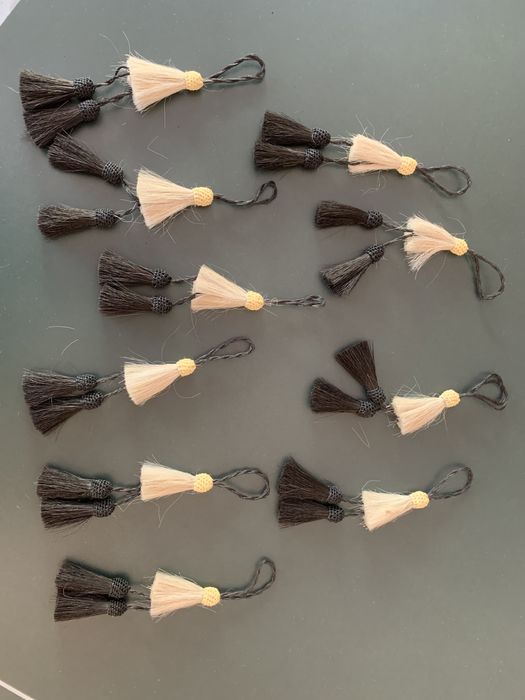 Mosqueteiras e pompons á espanhola