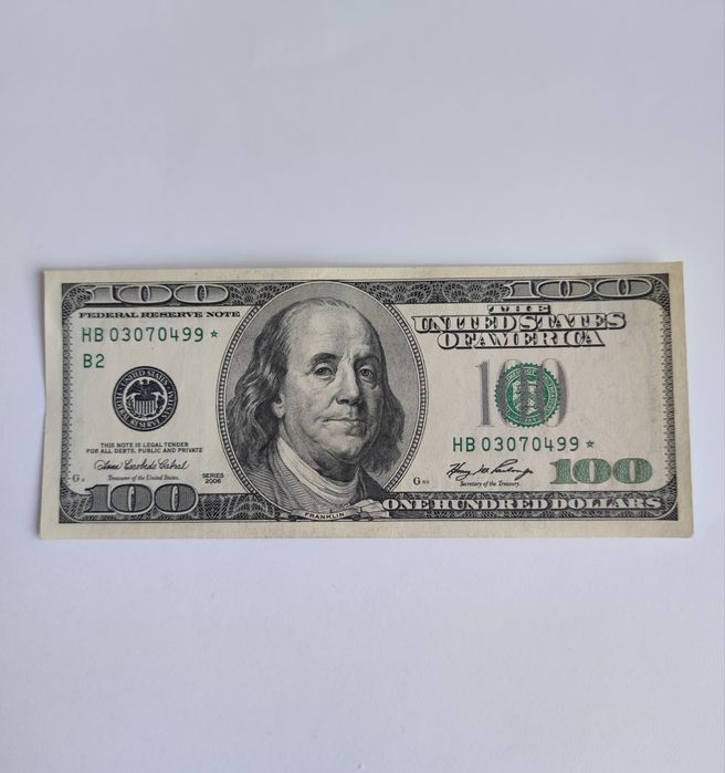 100 долларов со зведочкой