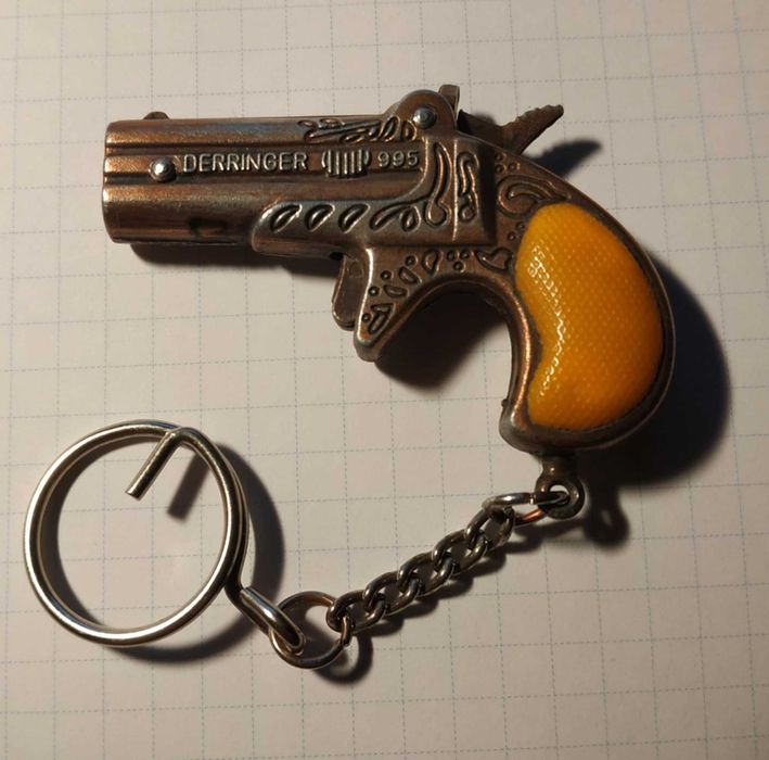 Brelok Derringer 995 podwójna lufa 6,5cm Zawieszka brąz - pomarańcz