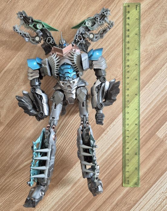 Трансформери: Епоха вимирання. Платиновий лідер класу, Грімлок.

вимир