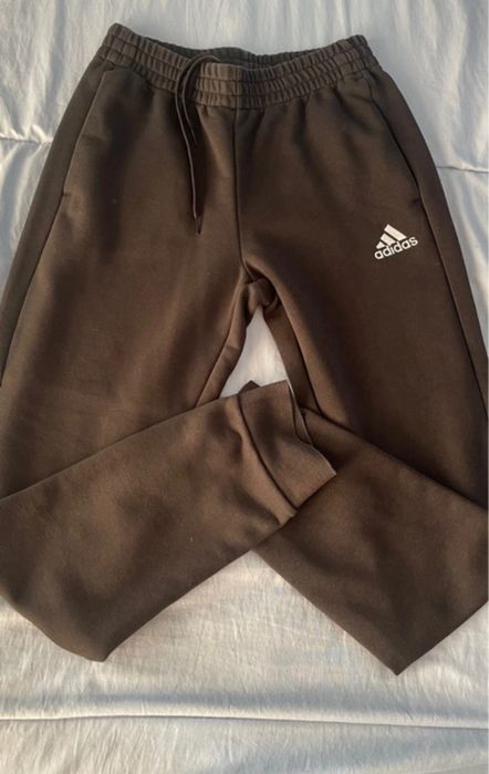 Calças pretas da adidas