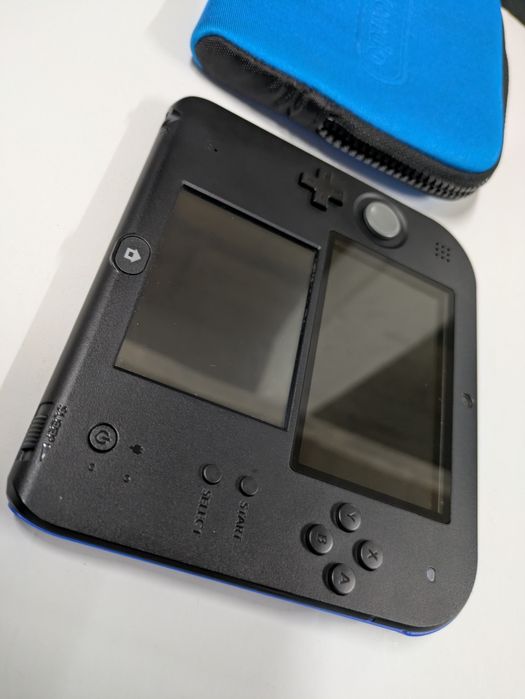 Nintendo 2DS (Super Mario Bros.2)
Super Mario Bros.2) pré instalado
Ca