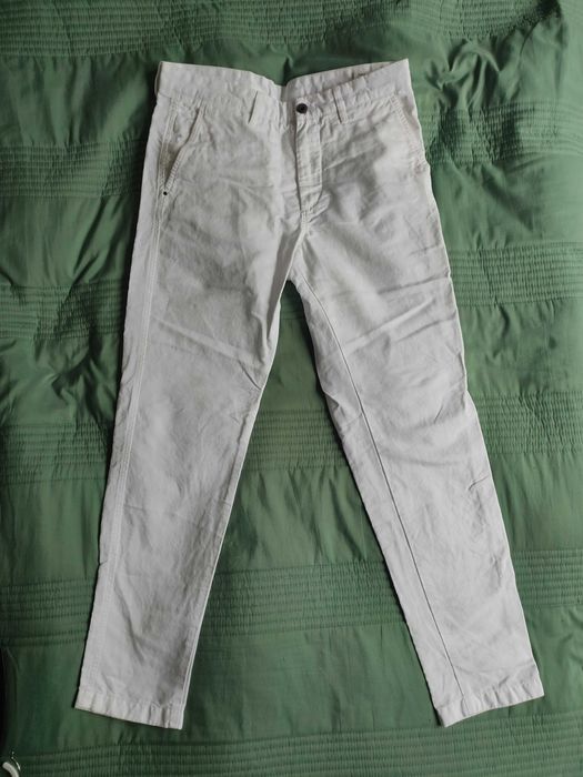 Lniane spodnie męskie Massimo Dutti w kolorze białym, idealne na lato.