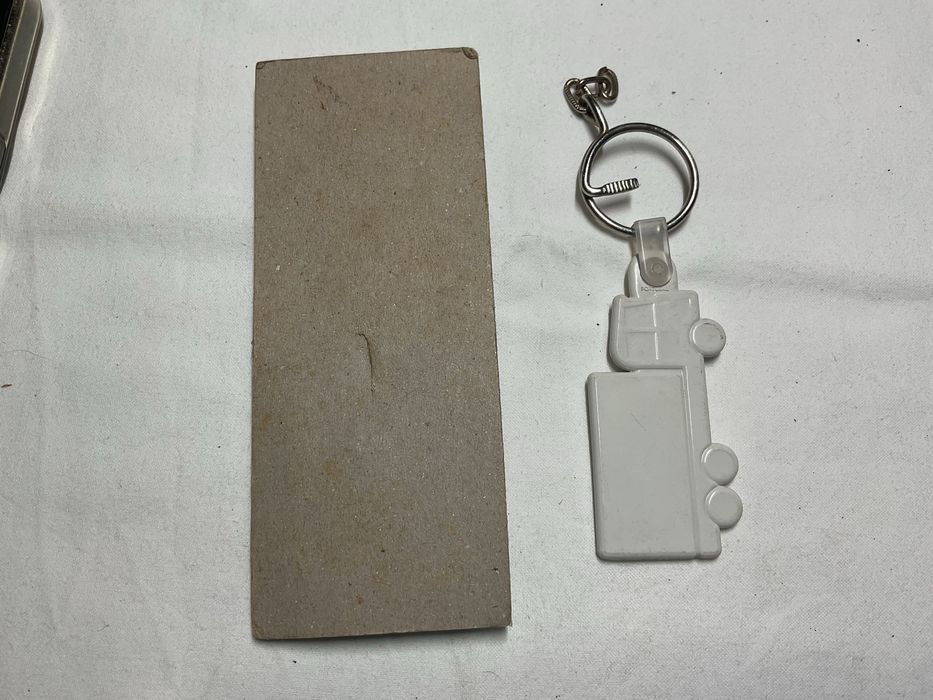 Dois porta chaves da Delta Cafés