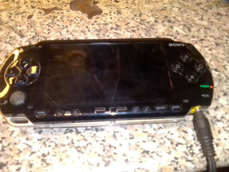 PSP 2, tablet para ver fotos e um radio