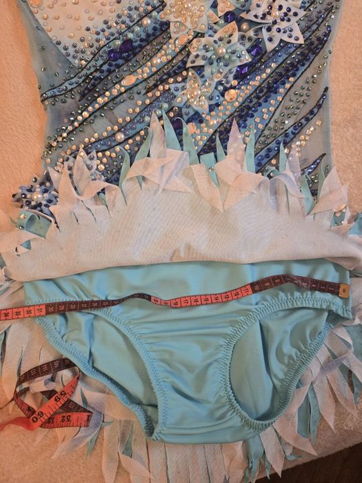 Ціну знижено!Неймовірний гімнастичний купальник 10-12 років.