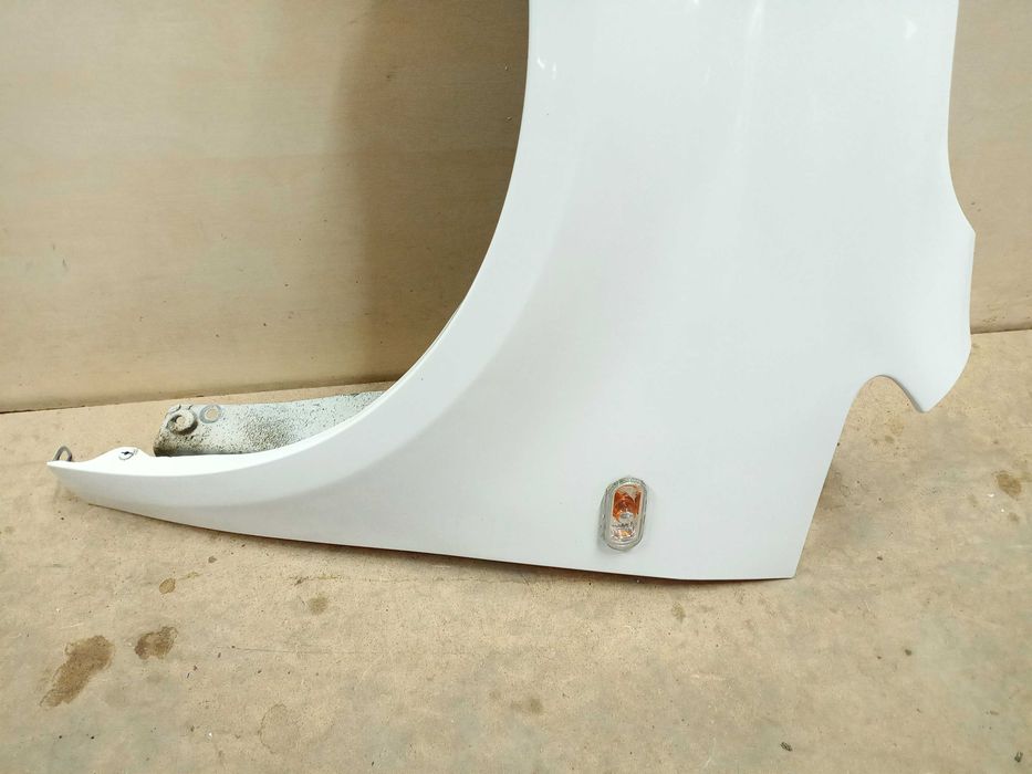 VW Caddy Touran 1 3 lift 2014r. błotnik lewy przód przedni biały