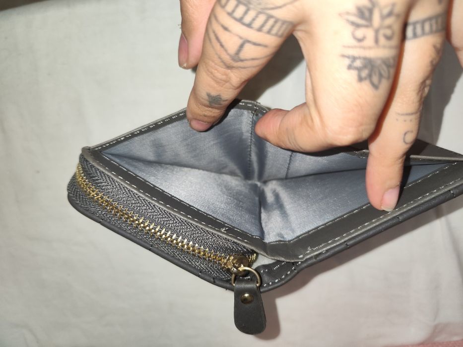 Porta moedas igual a novo