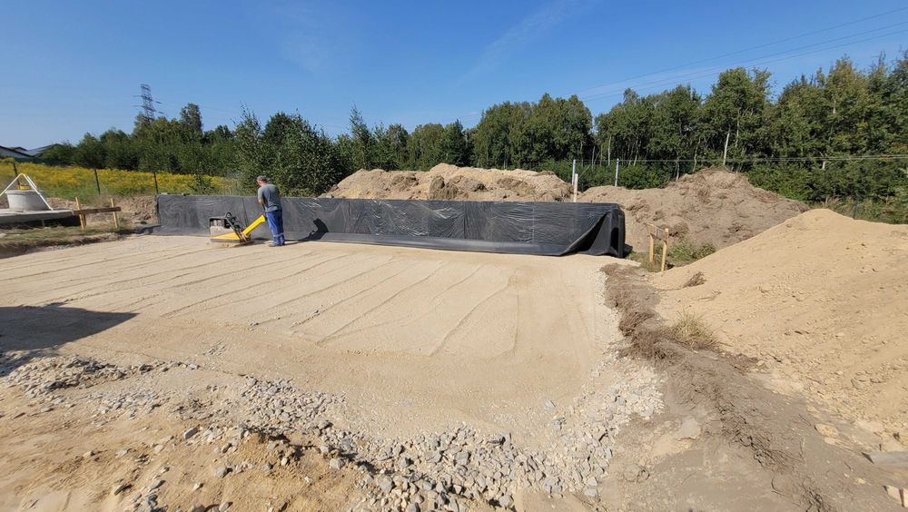 Budowa Domów fundamenty plyty fundamentowe Koparka zasypka piasek