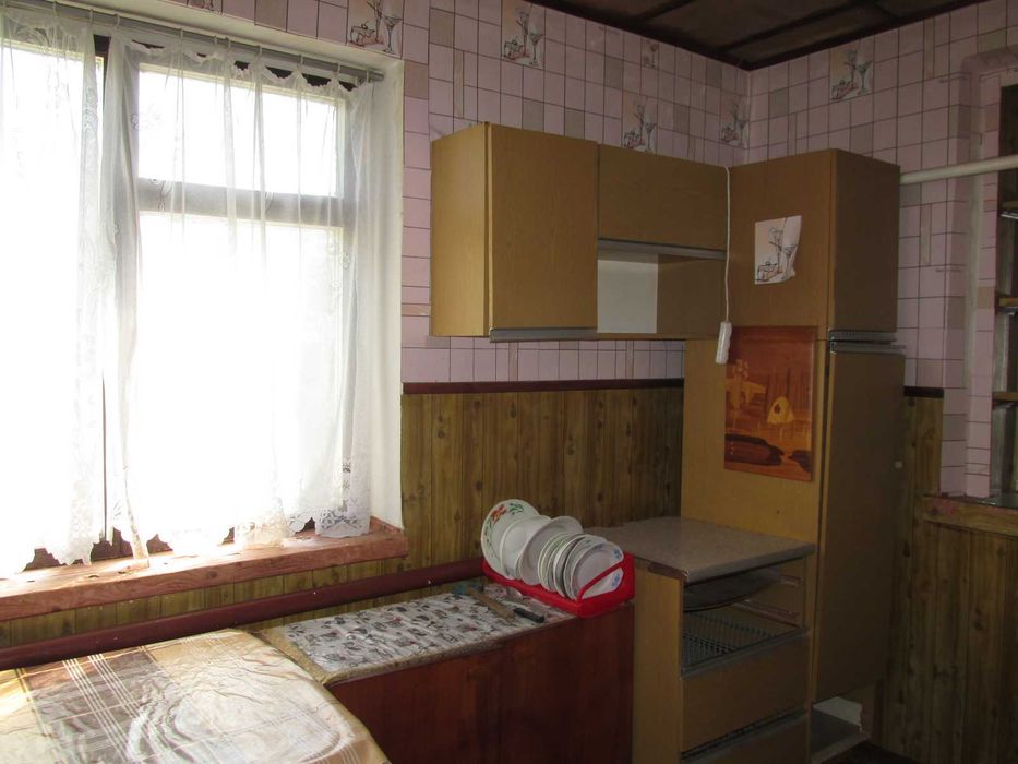 Продам частину будинку по вул. Тітова ( район Дитячої лікарні)
