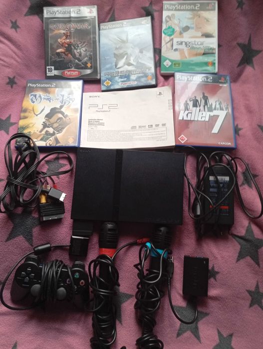 Sprzedam Playstation 2 slim z osprzętem +Singstar z mikrofonami+Gry