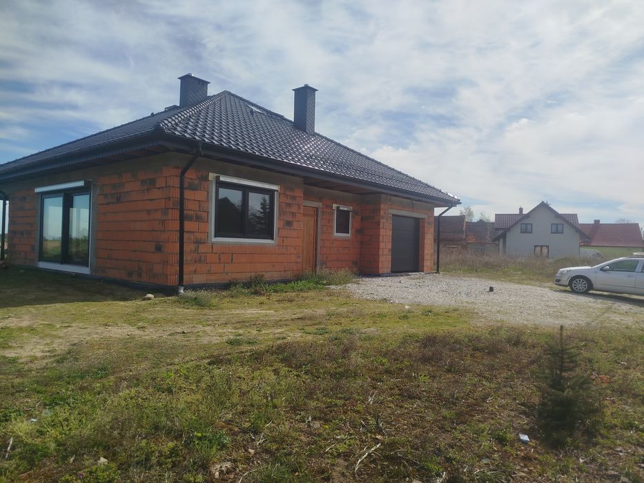 Sprzedam 1/2 własności domu i całej działki