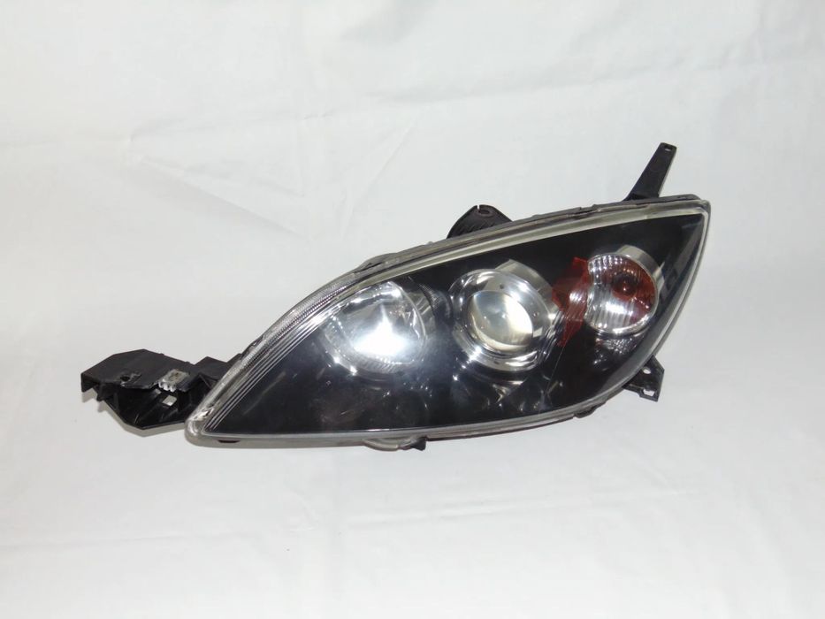EUROPA oryginalna lampa przednia przód lewa Mazda 3 I BK 03-06r