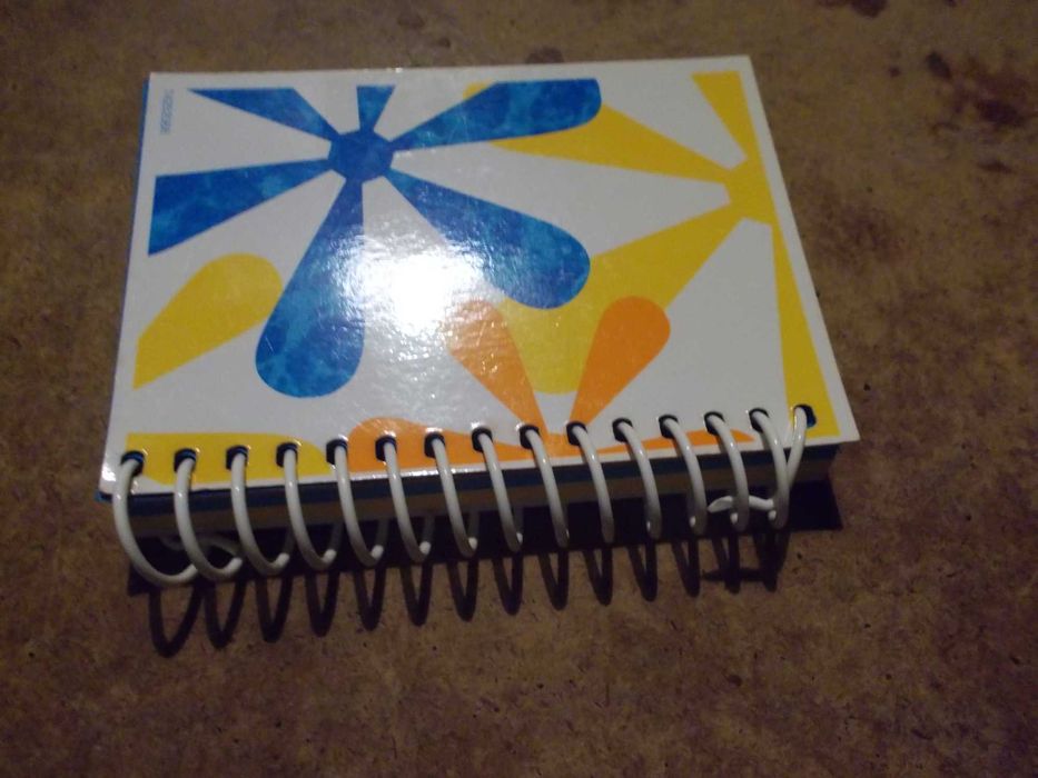 pequeno caderno em espiral da Evax