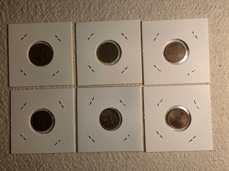 6 moedas de 20 centavos com várias datas