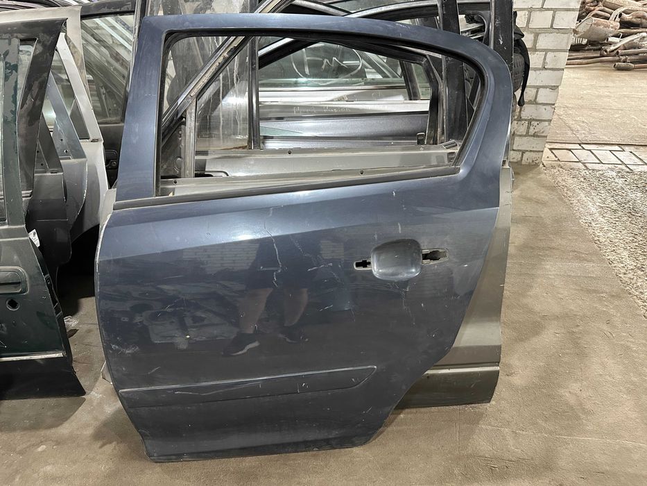 Дверь задняя левая OPEL Corsa D 06-
