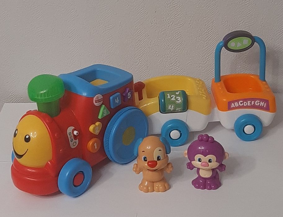 Развивающая игрушка "Поезд умного щенка" от бренда  Fisher Price