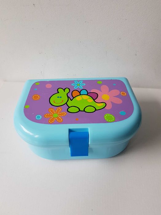 Niebieska plastikowa śniadaniówka lunchbox z zielonym dinozaurem