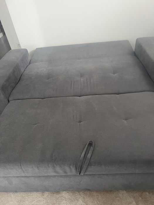 Sofa cama em tecido cinzento