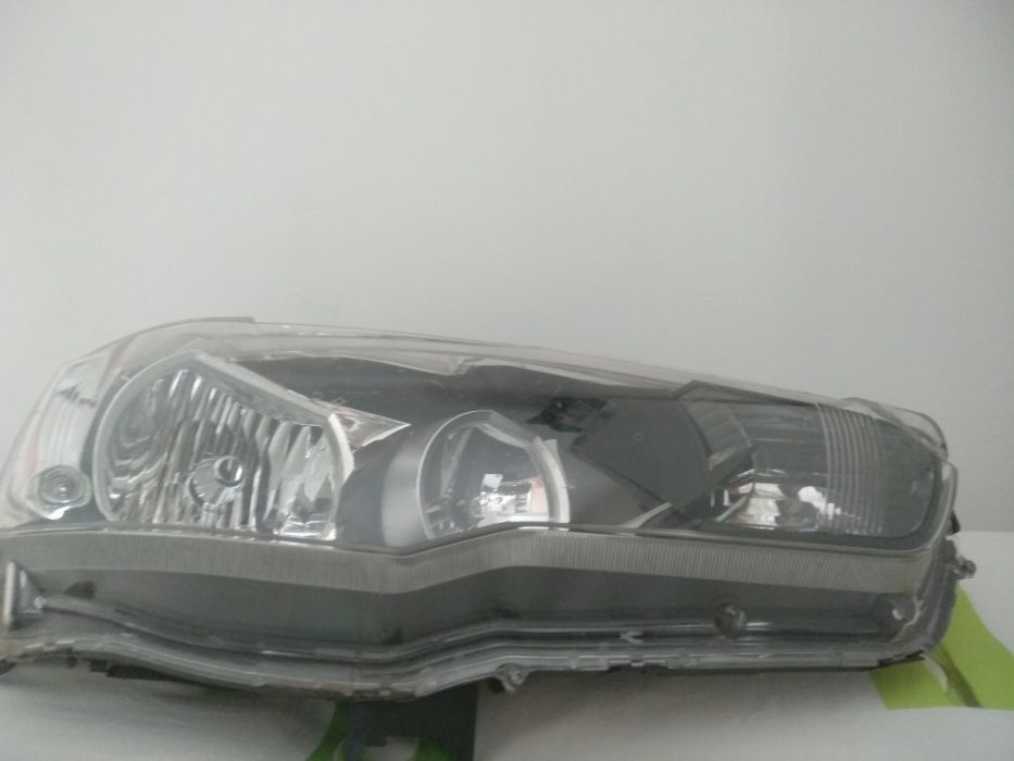 8301C338 MITSUBISHI зап.части  фары Лансер х