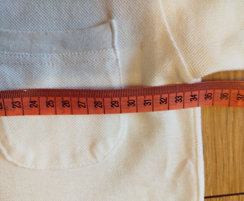 Biała koszulka polo dla chłopca