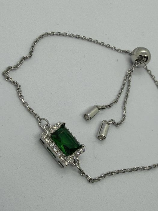 Bransoletka ściągana z zielonym oczkiem sygn Swarovski